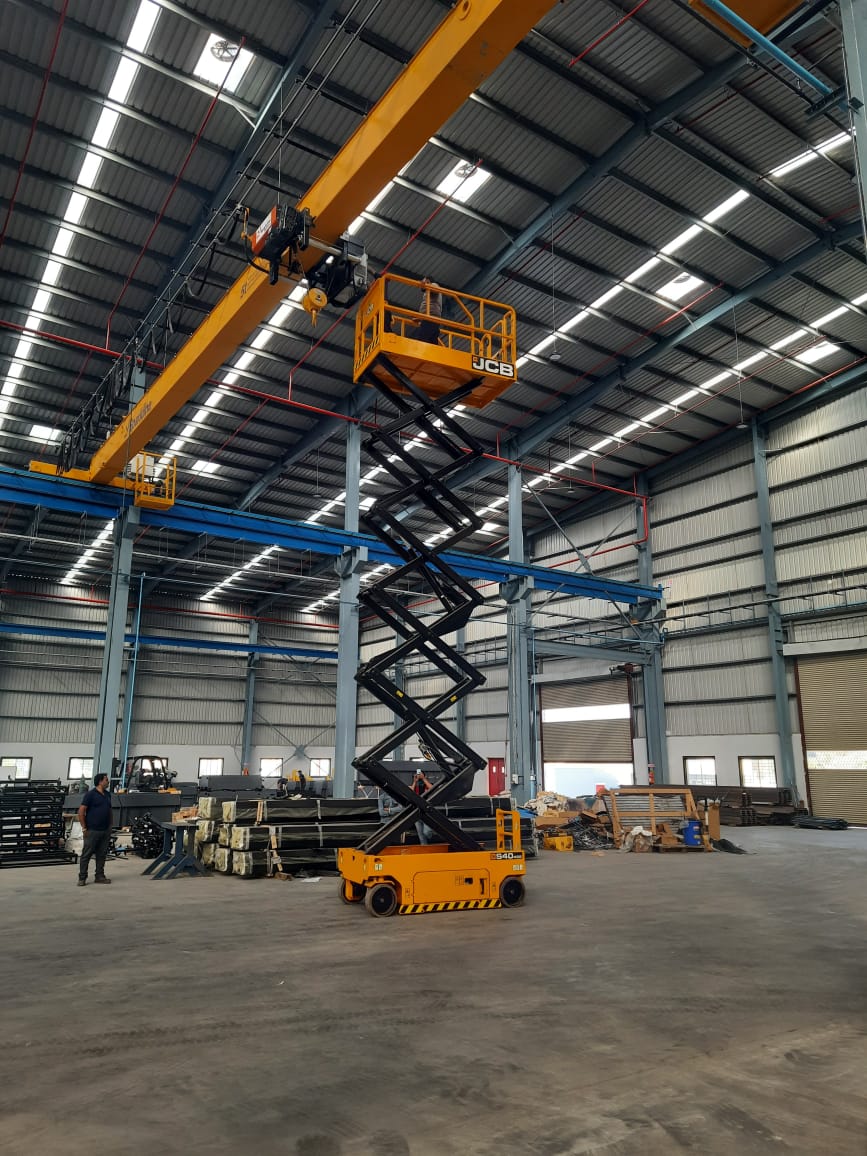 JCB Access electric scissor lift in JCB Safety Yellow chassis